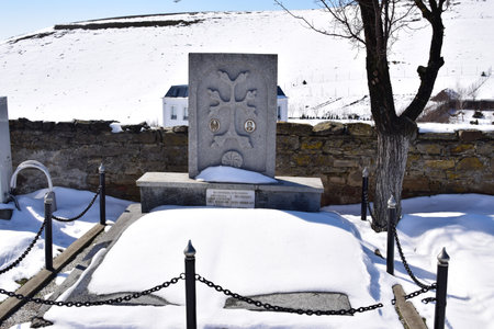 Serene view of a grave in a cemetery in the snow Hagigadar, Romaniaの写真素材