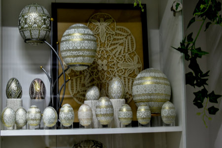 Easter eggs in a white vase on a shelf in a shop