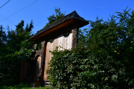 Wooden house in the village on a background of blue sky.の写真素材