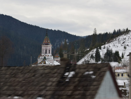 View of the church of St. Nicholas on the background of the mountainsの写真素材
