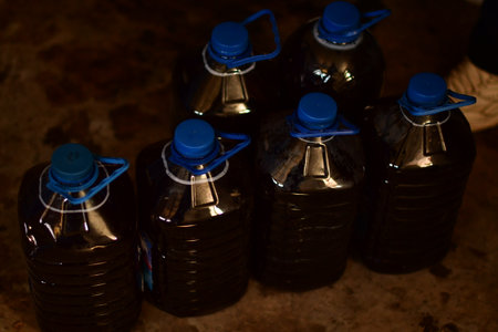 Plastic bottles with water on a rusty background. Selective focus.の素材