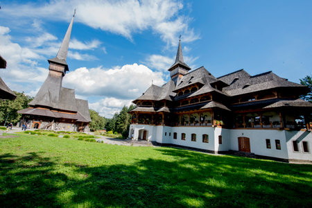 Unidentified people visit the old wooden church in Zakopane, Polandの写真素材