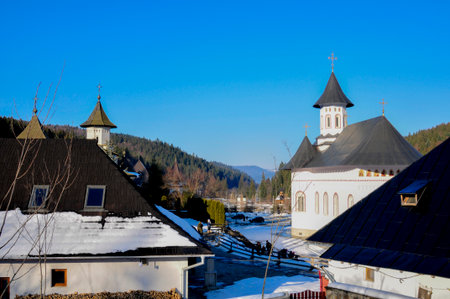 Church in the village on a background of mountains and blue sky.