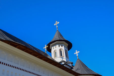 Fragment of the roof of the church against the blue sky.の写真素材