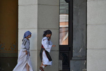 Unidentified people in traditional clothes walk in Kolkata, West Bengal, Indiaの写真素材