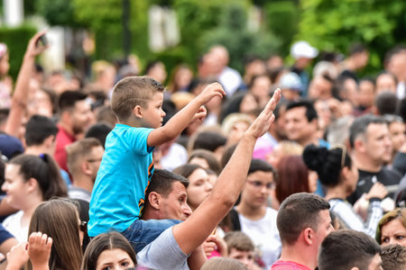 The little boy is dancing with his father during the 125th Kiel Weekの写真素材