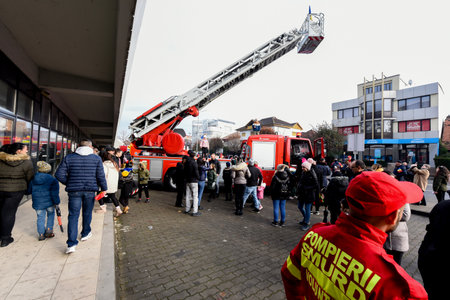 Red and white fire truck in front of the fire department during the protest against the government