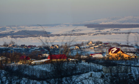 Village in the north of Hadambu Romania in the winter at sunset.の写真素材
