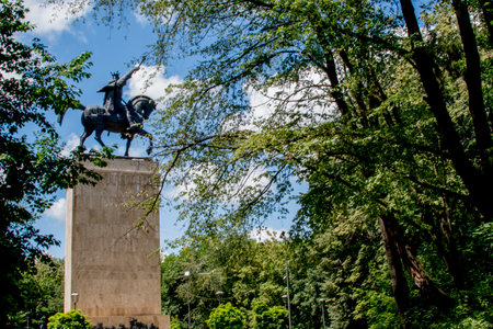 Sculpture in the park on a background of blue skyの写真素材