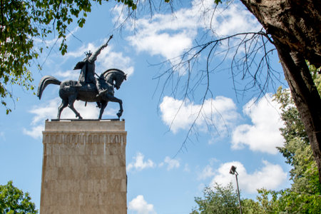 Sculpture of a man on a horse in the parkの写真素材