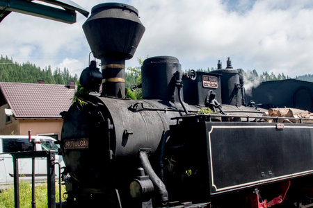 Old steam locomotive on the railway station in the Moldovita Romaniaの写真素材