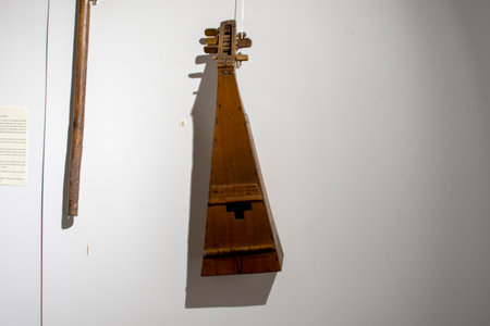 Old wooden balalaika on a white background. Musical instrument.の写真素材