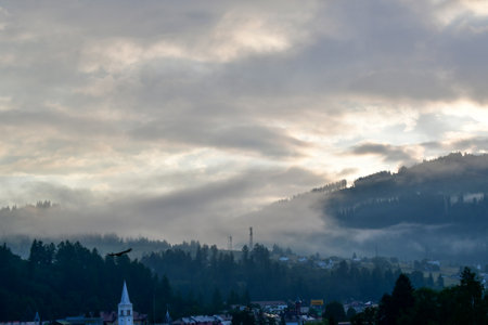 Foggy morning in the city of Carpathians, Romaniaの写真素材