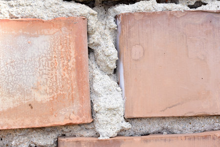 Old brick wall with cement mortar. Abstract background and texture for design.の写真素材