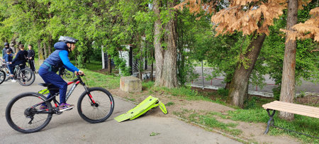 A cyclist rides a bicycle through the park.の写真素材