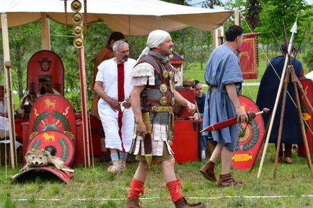Member of history club Golden Capricorn wears medieval costume as he participates in historical festival and camp in memory of King Vladimir in Kiev, Ukraine.の写真素材