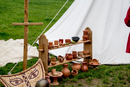 A close-up shot of a tent with clay pots and other objectsの写真素材