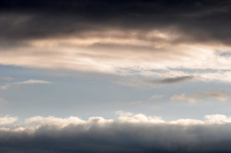 Cloudscape, Clouds at Sunset near the Ocean with a Dark Sky