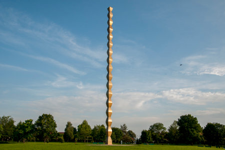 Sculpture in the park on a background of blue skyの写真素材