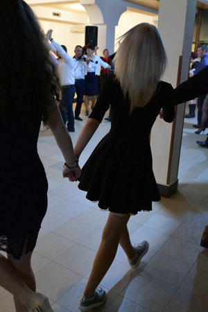 Couple dancing in the hall of a shopping center. Shallow DOF.