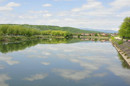 Landscape view of the river and the village in the mountains.