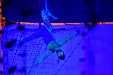 Artistic gymnastics performance in a night club, close-up