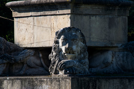 Statue of a lion at the entrance to the Piazza del Popolo, Rome, Italy