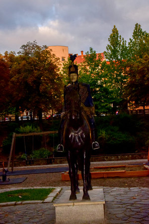 Statue of a boy riding a horse in Krakow, Poland.の写真素材