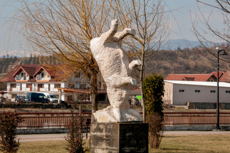 Statue of a goat in a park in the center of the cityの写真素材