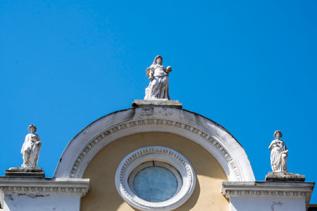 Statue of the Virgin Mary and Saint Joseph on the facade of the Church of San Giovanni in Turin, Italyの写真素材