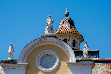 Sculptures on the roof of a building in the old town of Vilnius, Lithuania.の写真素材