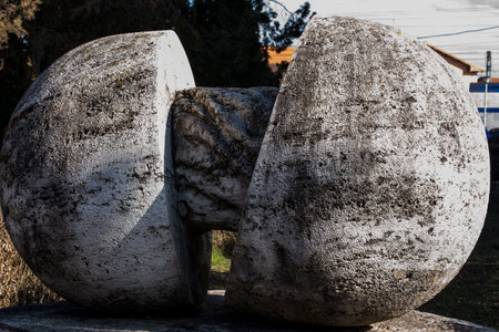 Granite stone sculpture in the park of Santo Stefano.の写真素材