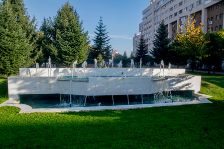 Fountain in the city park on a sunny summer day.の写真素材