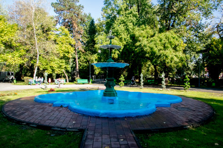 Fountain in the city park on a sunny summer day.の写真素材