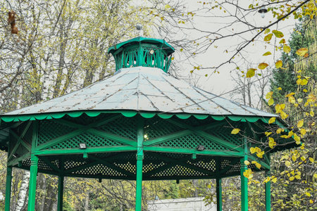 Wooden gazebo in the park on a sunny dayの写真素材