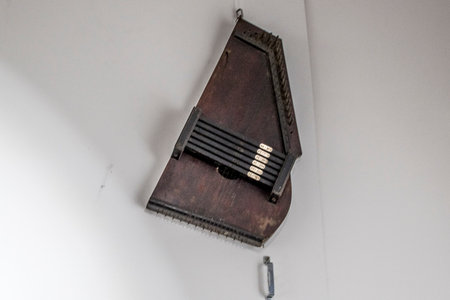 Thai music instrument on the white wall in the room, Thailand.の写真素材