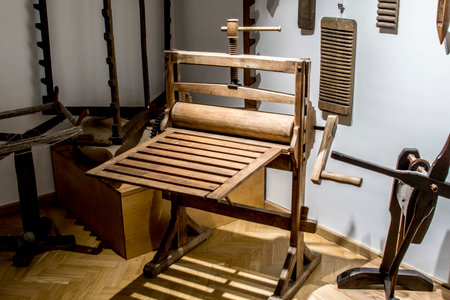 Vintage wooden hand weaving machine in a museum. Selective focus.