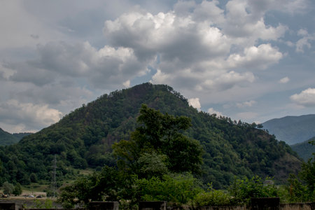 Landscape view of mountains and cloudy sky in the countryside.