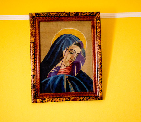 Portrait of the Virgin Mary in the picture frame on the wallの写真素材