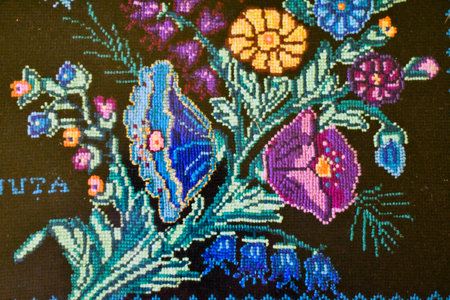 Colorful embroidery on the fabric close up. Abstract background