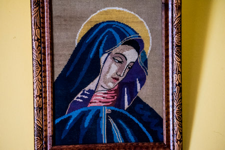 The image of the Virgin Mary in the picture frame on the wallの写真素材