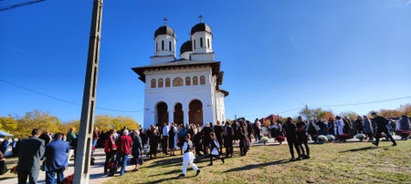 Unidentified people visit the Cathedral of St. John the Baptist in Novaci Romaniaの写真素材