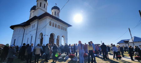 Unidentified people visit the Holy Trinity Cathedral in Novaci Romania