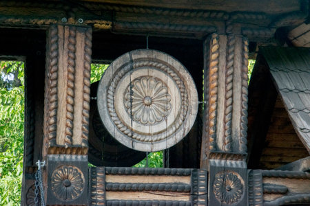Wooden carved in the shape of a circle on a wooden backgroundの写真素材
