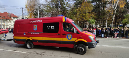 Red and yellow ambulance car at the Independence Day parade in Targu Jiu Romania