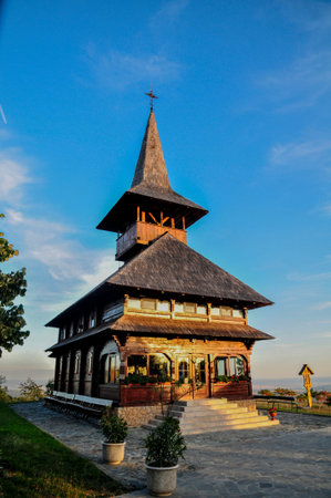 Old wooden church in the park at sunset, Chiang Mai, Thailand.