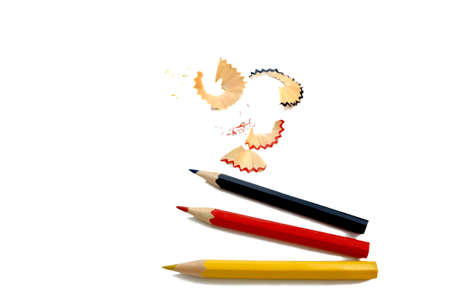 sharpened pencils and wood shavings isolated on whiteの写真素材