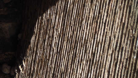 Light and shadows on the wall of brick and mortar.の写真素材