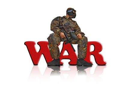 Paintball fighter sitting on the word の写真素材