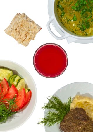 Front view of the chiken soup, tomato and cucumber salad,  mashed potatoes with meat rissoles, juice and cake. Isolated on white.の写真素材